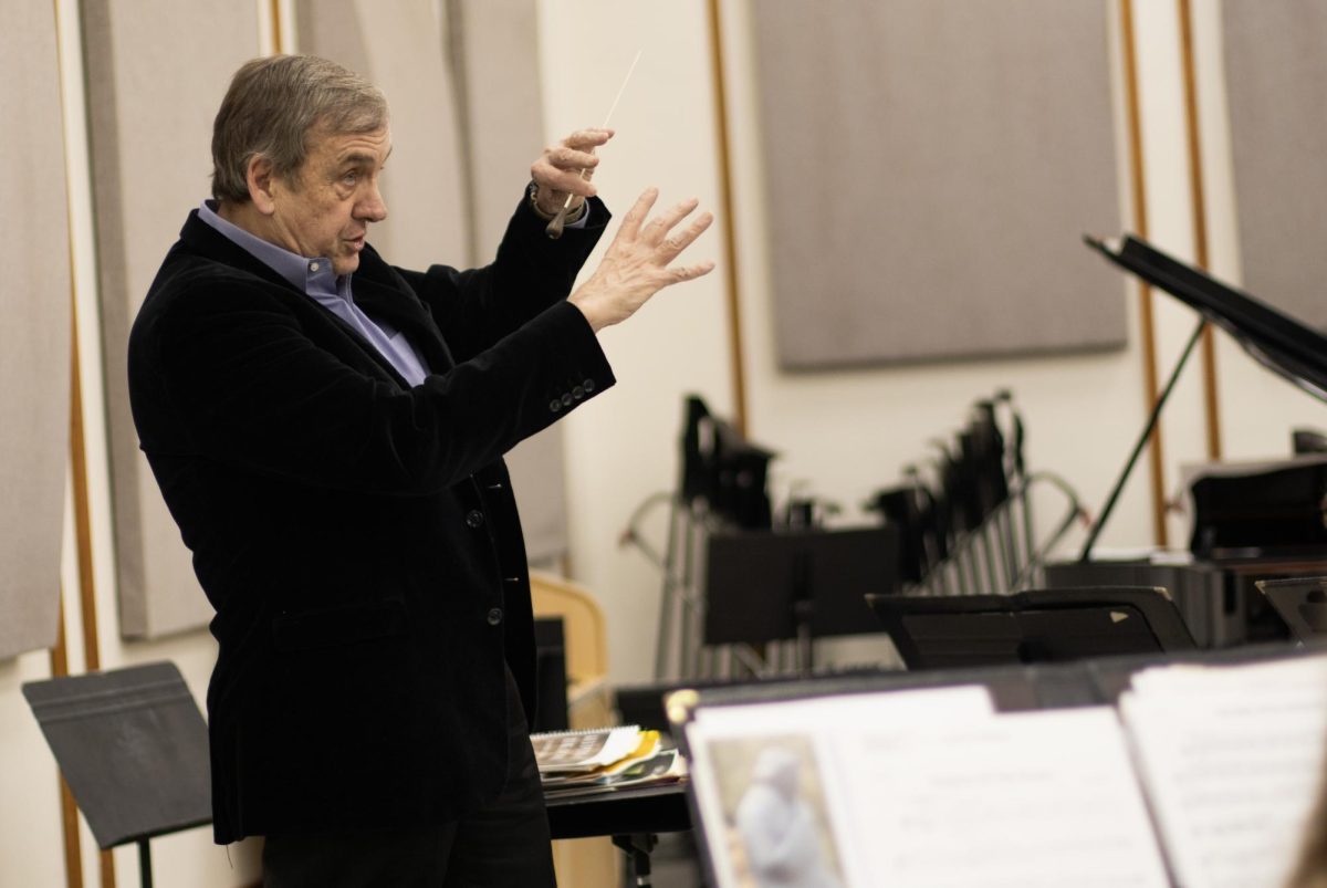 Dr.+Richard+Fischer+conducts+the+Wind+Symphony+in+rehearsal+on+Feb.+8.