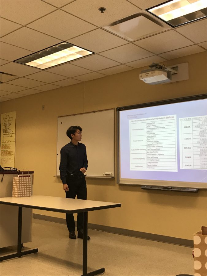 Shuo Liu presenting at the Symposium Meeting on October 12, 2018.