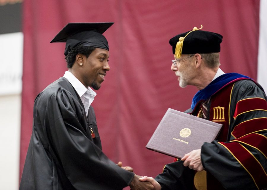Photo Credit to Facebook.com (CUC)
Leroy Bridges accepting his diploma from Dr. Gard