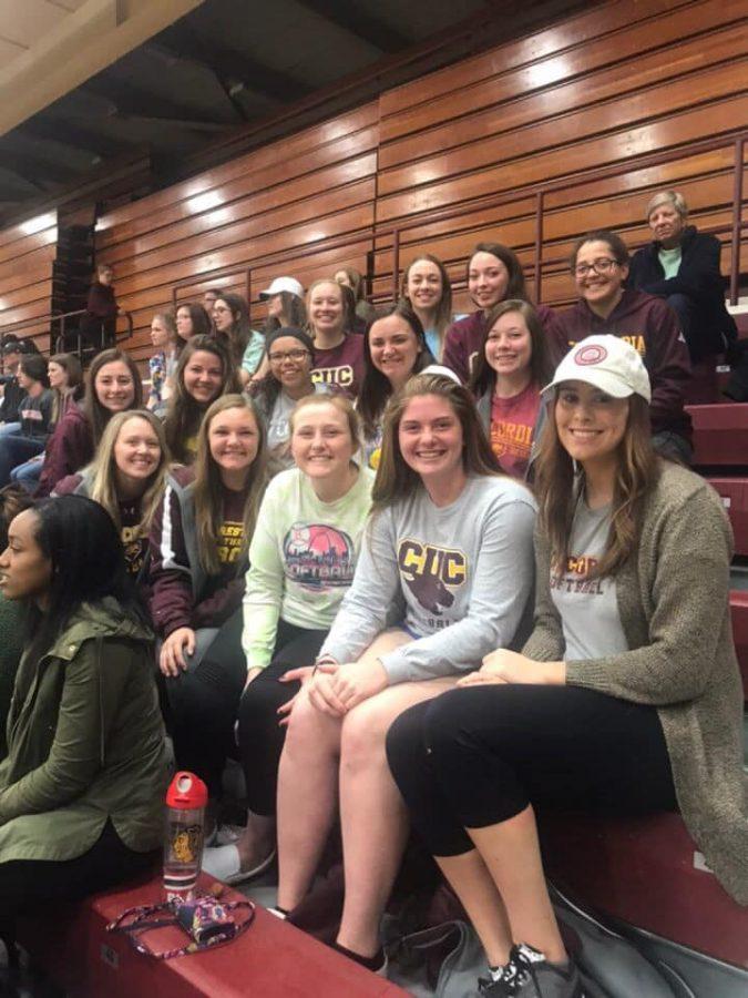 CUC Softball poses for a picture to post on social media as they support the CUC Men’s Volleyball team. Back Row (Left to Right): Marita Van Dyke, Kristen Landon, Taylor Kulaszewicz, and Melissa Balkema. Middle Row (Left to Right): Reilly McGuire, Kate Roberts, Shania Phillips, Sydney Getz, Sydney Sterrett. Front Row (Left to Right): Sydney Paulauskis-Lauher, Holly Bathje, Kacey Powers, Claire Urchell, and Kelly Tarasiewicz. 
(Photo Credit to Holly Bathje)