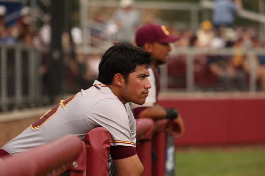Mateo Calle observing the CUC baseball game. (Photo Credit to Kayla McCloud)