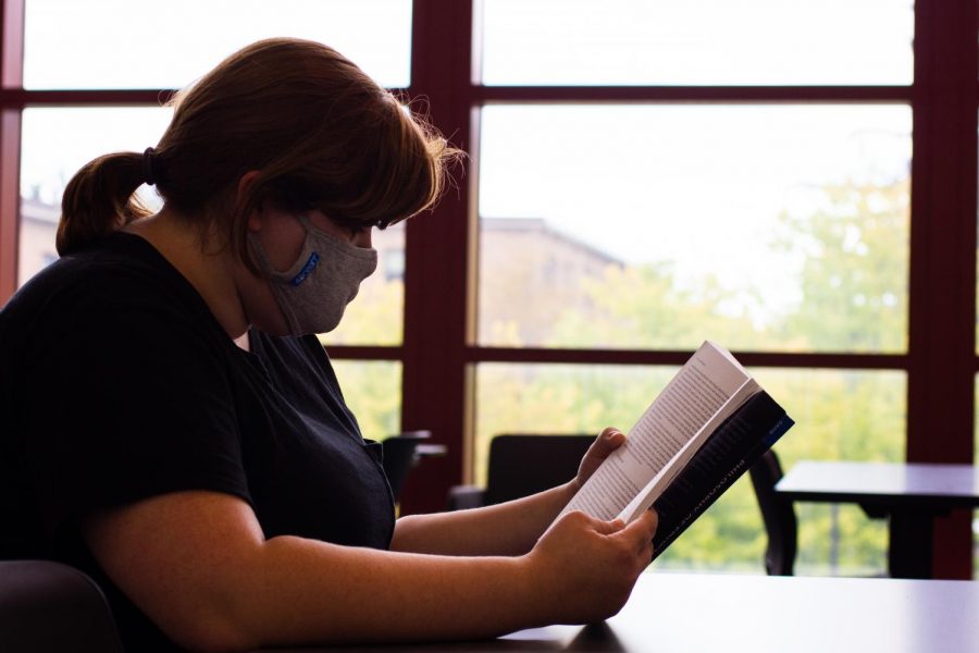 A CUC student reads at the new CULearn Teaching and Learning Commons in the Christopher Center.