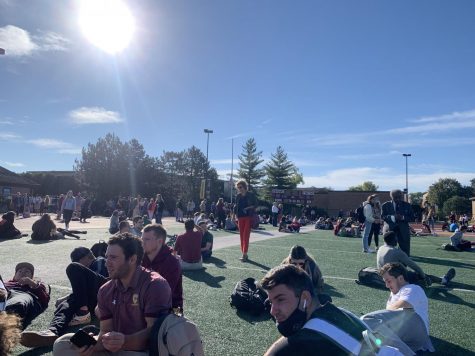 CUC students gather on the football field awaiting updates regarding the campus-wide evacuation on October 19, 2021.