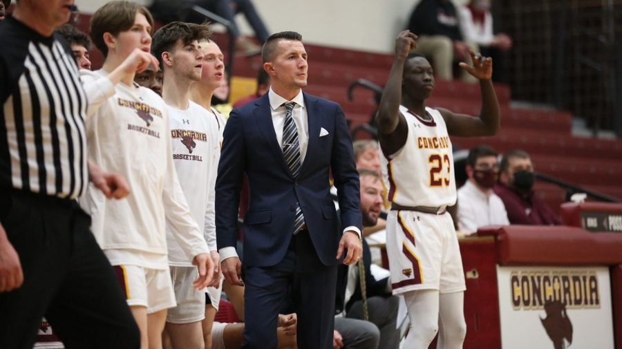CUC men's basketball  head coach Steve Kollar watches the action from the sidelines.