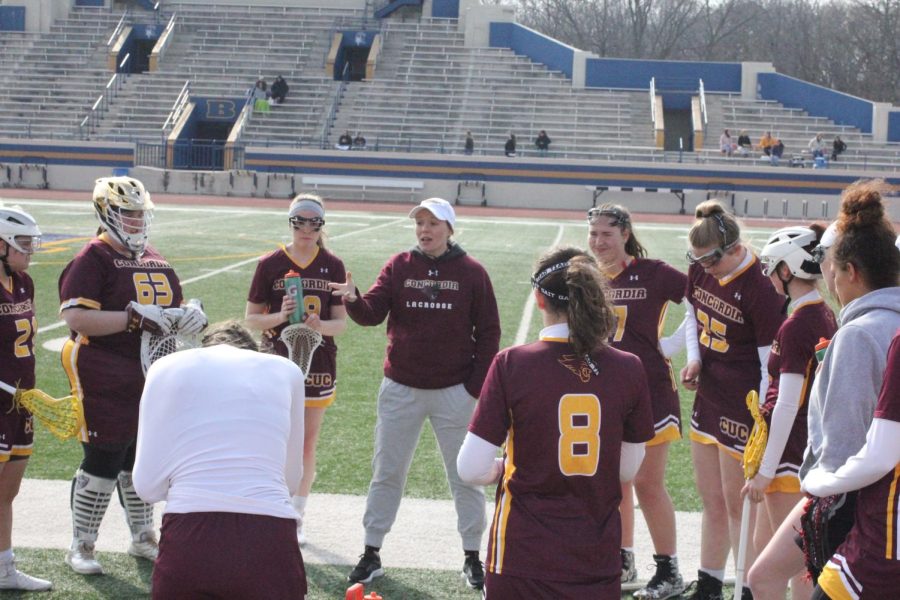 Coach Fran Meyer coaching the Concordia University Chicago Women's Lacrosse Team at Beloit College on April 5th.