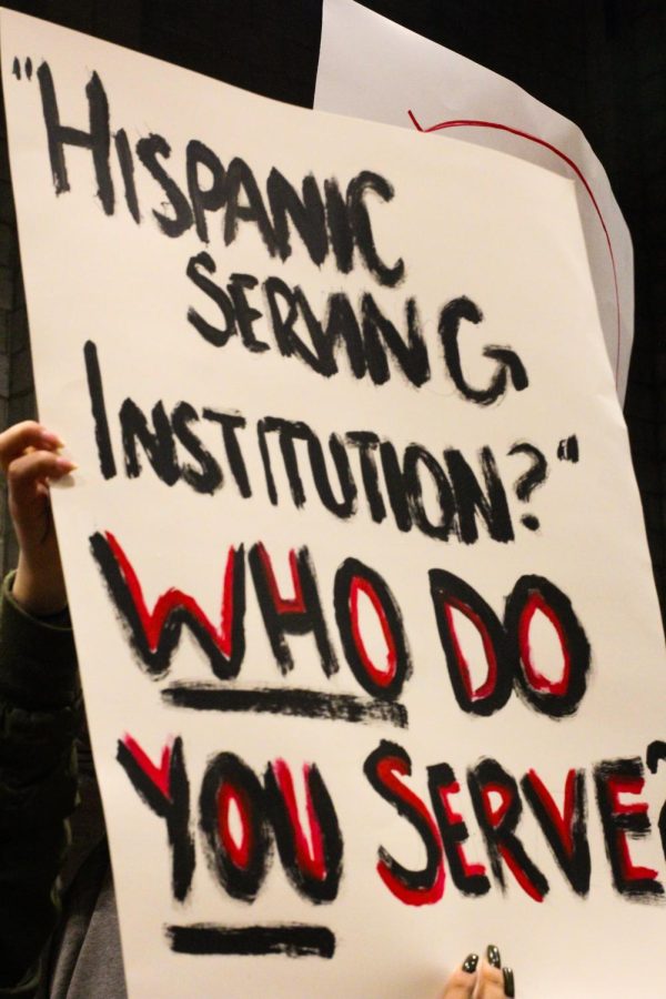 A student sign questioning the service of the campus to the Latino campus population. 