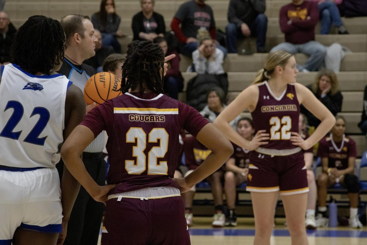 CUC Womens Basketball Player Jaylene Wade (#32) and Linley Southern (#22) awaiting referee decision. 