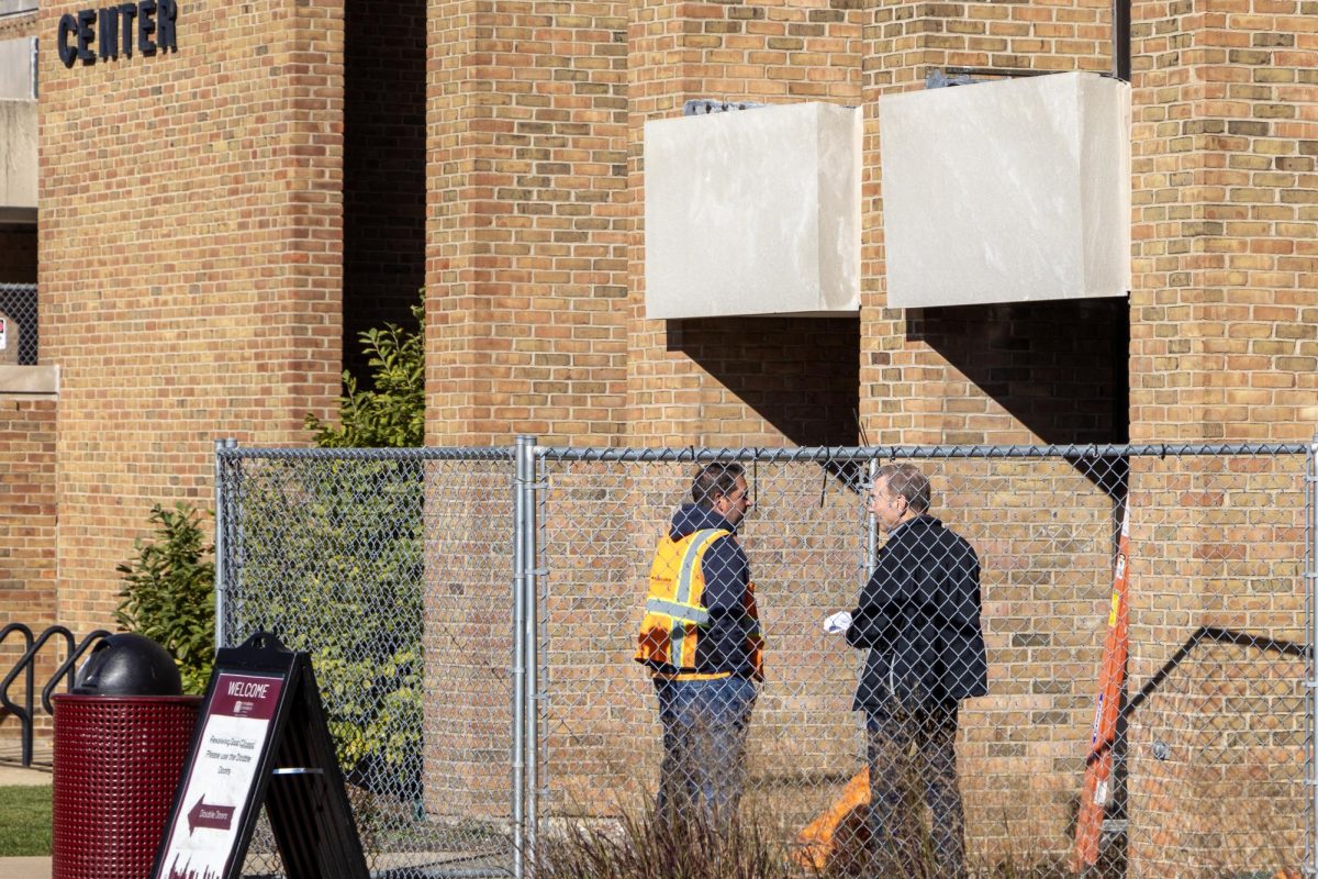 Contractors begin repairs to the KCC Revolving Door Facade on 