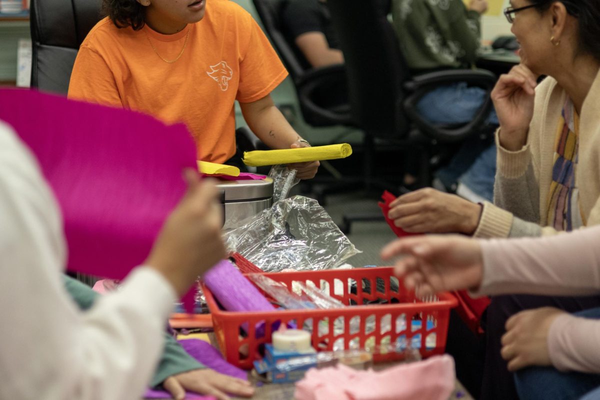 Recent collaborative event between the Latino Student Union and Poetry Club at "Papel Picado, Poems, & Pan Dulce" event in the Trailblazer center in the Klinck Memorial Library 