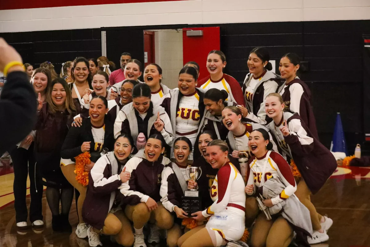 Concordia University Chicago Dance Team celebrates their Concordia Invitational Tournament victory on Jan 25.