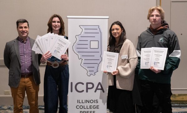 Left to right: Spectator faculty advisor Denny Watkins, editor-in-chief Katelyn Whitlock, campus editor Melissa Alfaro, and sports editor Jonathan Aungst with their awards from the Illinois College Press Association conference on Saturday, Feb. 21.