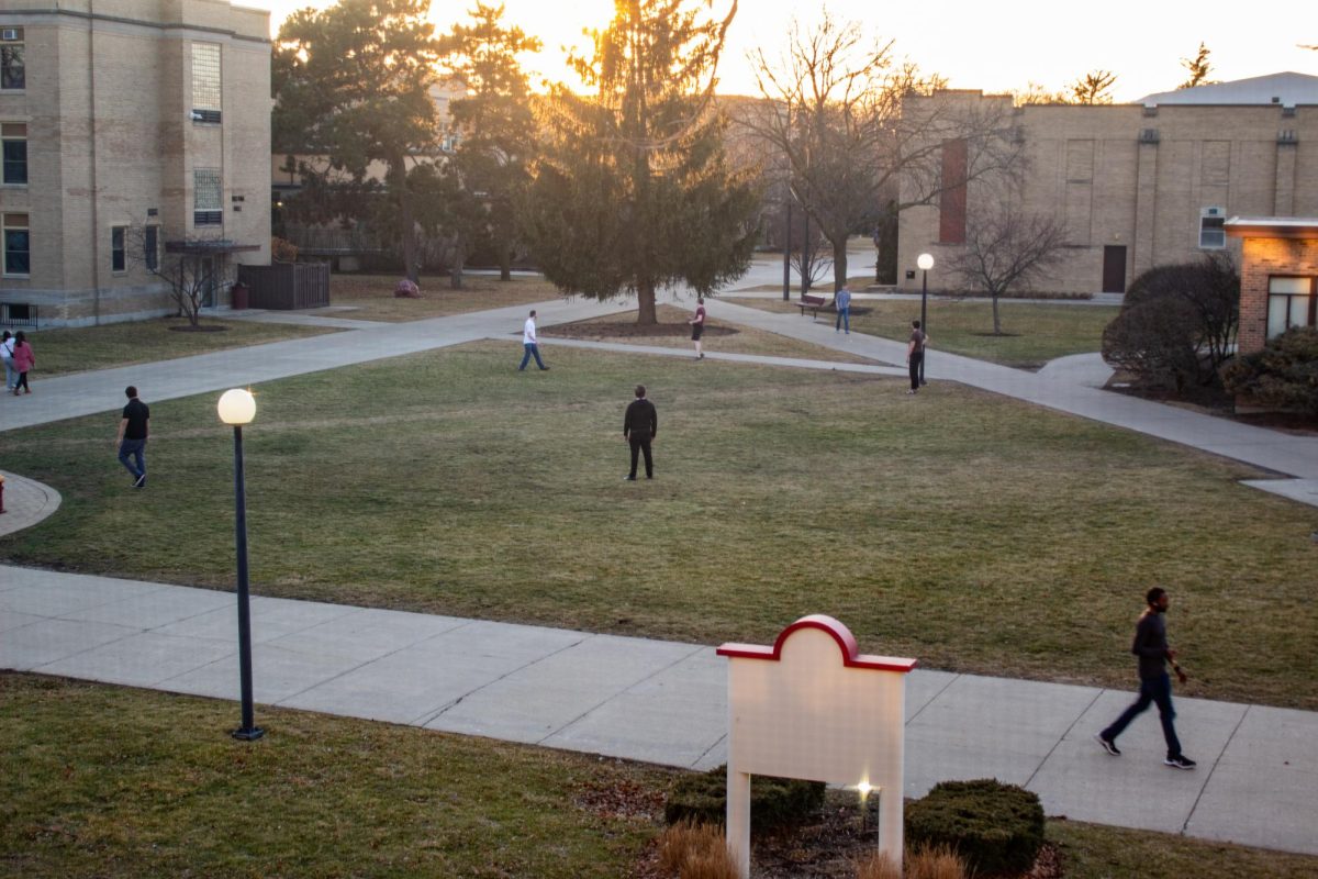 Students play frisbee and football in the Triangle and enjoy the warm weather on February 16th.
