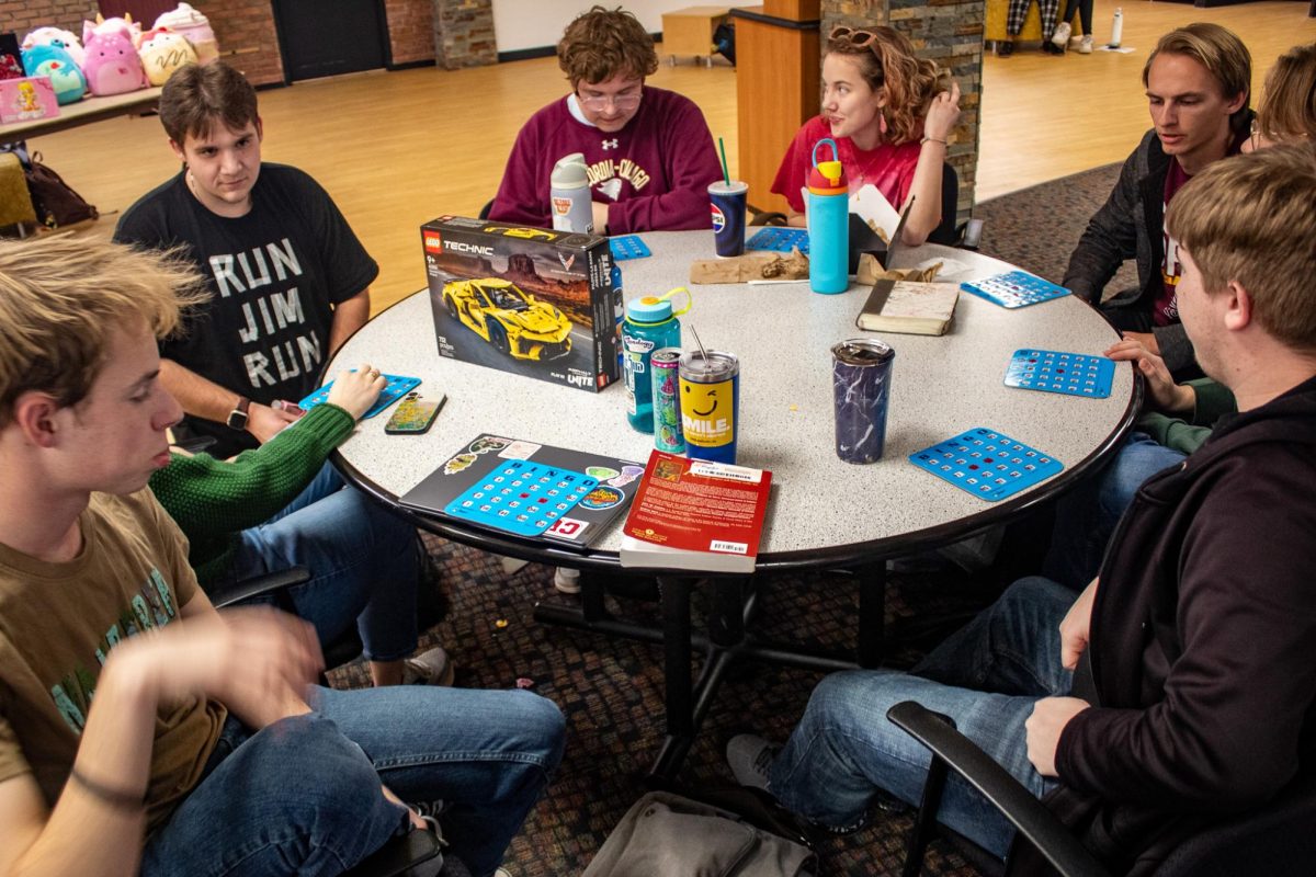 A table of students play Bingo in the Cougar Den for prizes of Lego and Squishmallows on February 10th.
