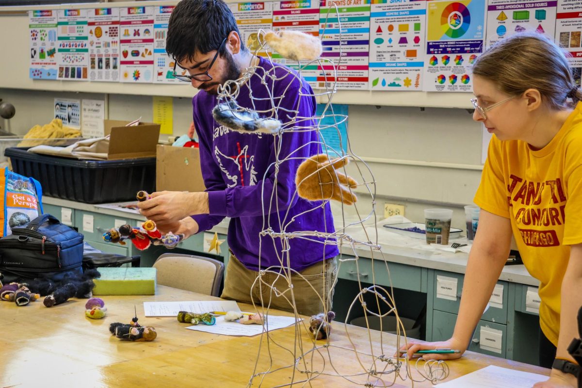 Students working on art projects in Advanced Studio Class