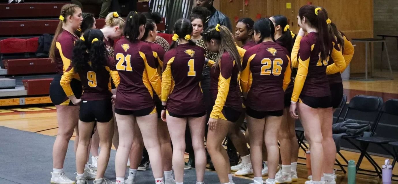 Cheer athletes prepare for a meet at Geiseman Gymnasium in 2025